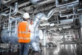 Engineer working in a thermal power plant with talking on radio Royalty Free Stock Photo