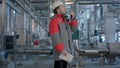 Engineer working in a thermal power plant with talking on the walkie-talkie for controlling work Royalty Free Stock Photo