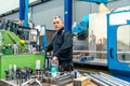 Engineer working using a cnc machine in a logistics factory