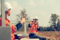 Engineer working at a wind farm for renewable energy has the responsibility of maintaining a sizable wind turbine. Encourage one Royalty Free Stock Photo