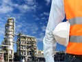 Engineer works in a refinery for the production of fuel