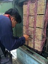 The engineer works with the telephone exchange equipment.