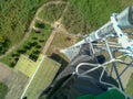 An engineer works at the top of a tower, Iran, Gilan