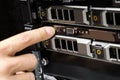 Engineer's Finger Switching On Server At Data Center