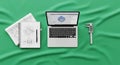 Engineering Blueprint, Laptop CAD Design, and Digital Caliper on Green Fabric Royalty Free Stock Photo