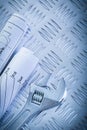 Engineering drawings monkey wrench on corrugated metal sheet con Royalty Free Stock Photo