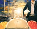 engineering man and safety helmet against oil refinery industries plant Royalty Free Stock Photo