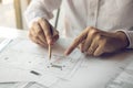 Engineering man showing blueprint detail for people buying house Royalty Free Stock Photo