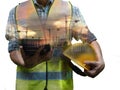 Engineering man standing with yellow safety helmet and holding tablet isolated on white background, work concept Royalty Free Stock Photo