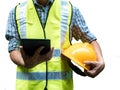 Engineering man standing with yellow safety helmet and holding tablet isolated on white background, work concept Royalty Free Stock Photo