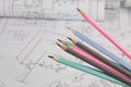 Engineering pencils on background of electrical engineering drawings