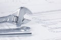 Engineering project drawing documents with wrench Royalty Free Stock Photo