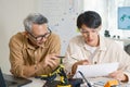 engineering robot technology with asian programmer innovation and research teamwork in coding development