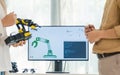 engineering robot technology with asian programmer innovation and research teamwork in coding development