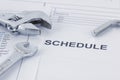 Engineering schedule documents with wrench. Maintencance concept Royalty Free Stock Photo