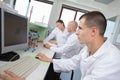 Engineering students in lab using computer Royalty Free Stock Photo