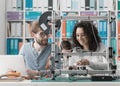 Engineering students using a 3D printer Royalty Free Stock Photo