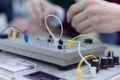 Engineering students working in the lab. Students are adjusting an electrical`s components inside lab Royalty Free Stock Photo