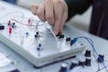 Engineering students working in the lab. Students are adjusting an electrical`s components inside lab Royalty Free Stock Photo