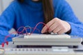 Engineering students working in the lab. Students are adjusting an electrical`s components inside lab Royalty Free Stock Photo