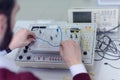 Engineering students working in the lab. Students are adjusting an electrical`s components inside lab Royalty Free Stock Photo