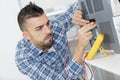 Engineering students working using voltage and current tester