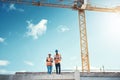 Engineering, tablet and team on building roof at construction site for vision, development or architecture. Black woman Royalty Free Stock Photo