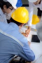 Engineering team is meeting, planning construction work at construction site/Selective focus Royalty Free Stock Photo