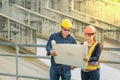 Engineering team Men and woman meeting with Engineers and supervisors are standing reading the blueprints at construction site