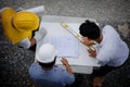 Top view of Engineer team look paper plan Royalty Free Stock Photo