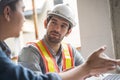 The engineering team working at building site meeting and discussing on laptop . Team onsite of architecture inspector and discuss