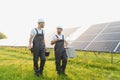 Engineering team working on checking and maintenance in solar power plant, Solar panel technician installing solar Royalty Free Stock Photo