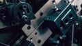 Engineering technology background. Close up of parts of industrial producing machine.
