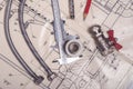 Engineering tools and plumbing details on a technical drawing. Design and production of communications. Caliper, pencil and ruler Royalty Free Stock Photo