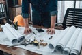 Engineering working with drawings inspection on the office desk and Calculator, triangle ruler, safety glasses, compass, vernier