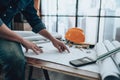 Engineering working with drawings inspection on the office desk and Calculator, triangle ruler, safety glasses, compass, vernier