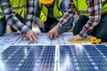Engineers and architect planning solar panel installation Royalty Free Stock Photo