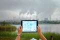 Engineers, architects or businessmen using tablets with the icon network are analyzing the operation of the coal power plant. Royalty Free Stock Photo