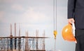 Engineers, Architects Carrying a safety helmet In the area under construction.