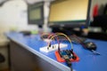 Engineers assemble electrical circuits from radio components in a laboratory