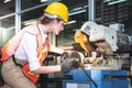 Engineers Caucasian woman are working using steel cutting machines