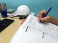 Engineer inspecting and checking datasheet. Royalty Free Stock Photo