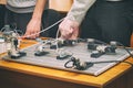 Engineers connect wires control panel with small test bench for experiments