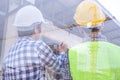 Engineers and contractors talk to the construction site or high-rise building. Royalty Free Stock Photo