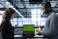 Engineers in data center using isolated screen mockup laptop Royalty Free Stock Photo