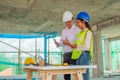 Engineers are discussing at building site Royalty Free Stock Photo