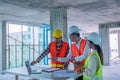 Engineers are discussing at building site Royalty Free Stock Photo