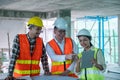 Engineers are discussing at building site Royalty Free Stock Photo