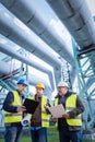 Engineers discussing maintenance of a petrochemical plant Royalty Free Stock Photo