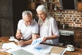 Engineers discussing over at building plan Royalty Free Stock Photo